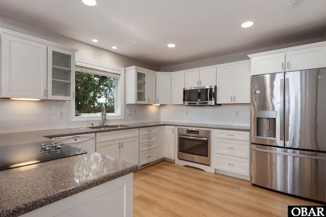 103 King Edward Ct Lot 13, Kill Devil Hills, NC 27948 - kitchen featuring stainless steel appliances, a sink, white cabinets, dark stone counters, and recessed lighting