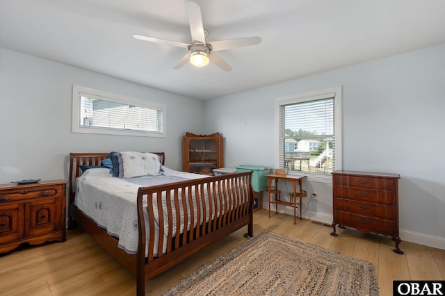 103 King Edward Ct Lot 13, Kill Devil Hills, NC 27948 - bedroom featuring wood-type flooring, multiple windows, ceiling fan, and baseboards