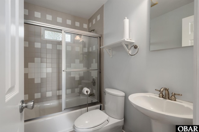 103 King Edward Ct Lot 13, Kill Devil Hills, NC 27948 - full bath featuring toilet, bath / shower combo with glass door, and a sink