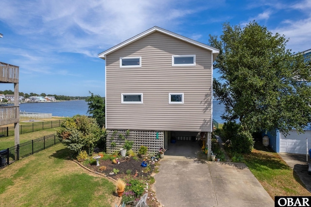 103 King Edward Ct Lot 13, Kill Devil Hills, NC 27948 - view of side of home featuring a water view, driveway, and a carport