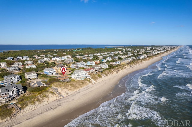 aerial view featuring a water view, a residential view, and a beach view