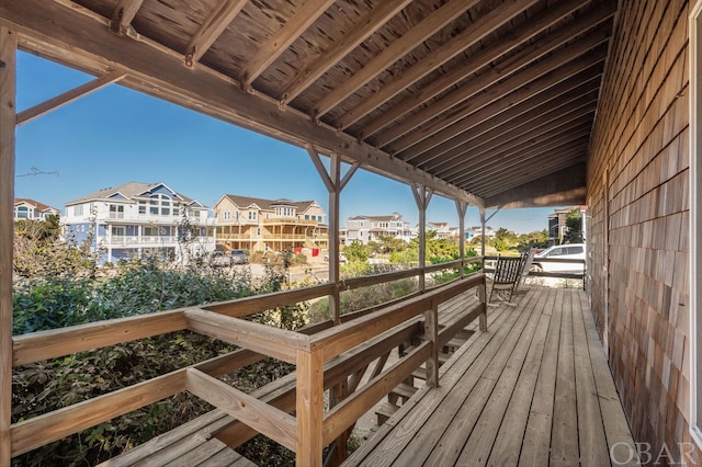 wooden deck with a residential view