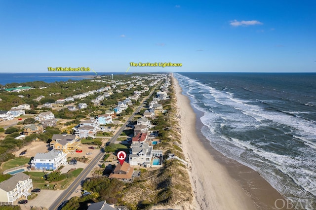 bird's eye view featuring a water view, a residential view, and a view of the beach