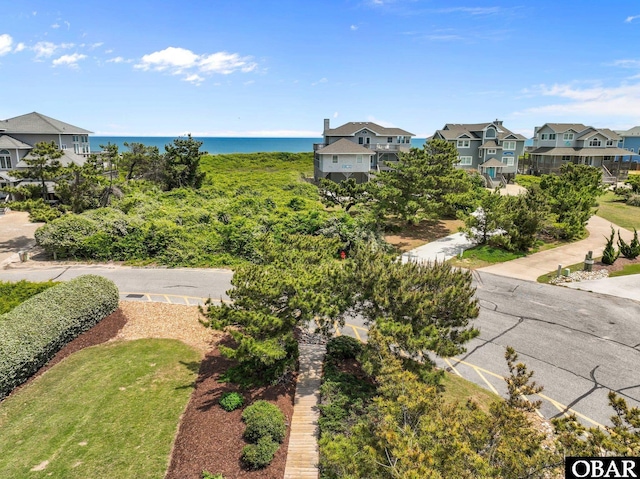 aerial view featuring a water view and a residential view