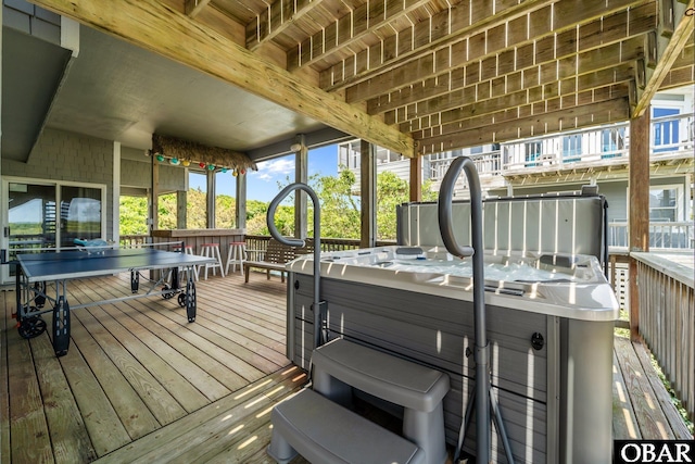 deck with a hot tub