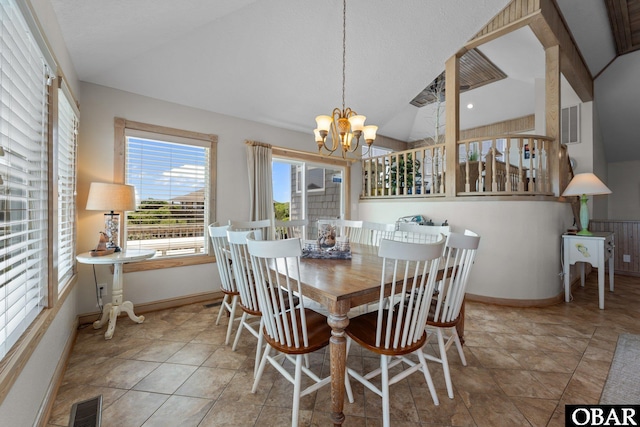 dining room featuring baseboards, visible vents, vaulted ceiling, and a notable chandelier