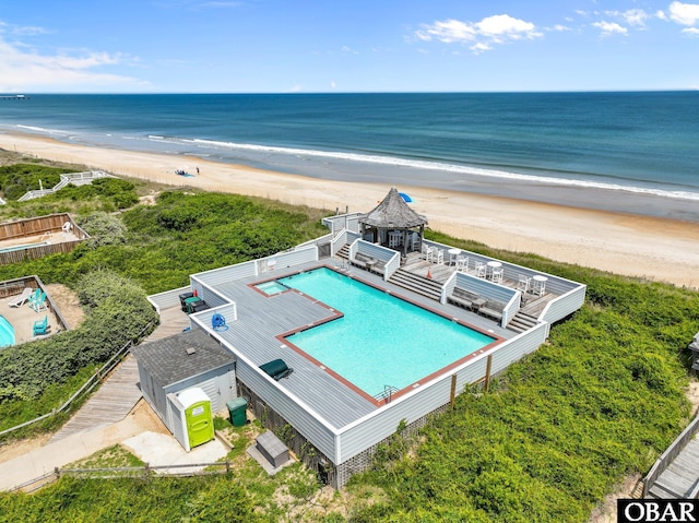 bird's eye view featuring a water view and a view of the beach