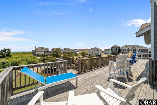 wooden terrace featuring a residential view