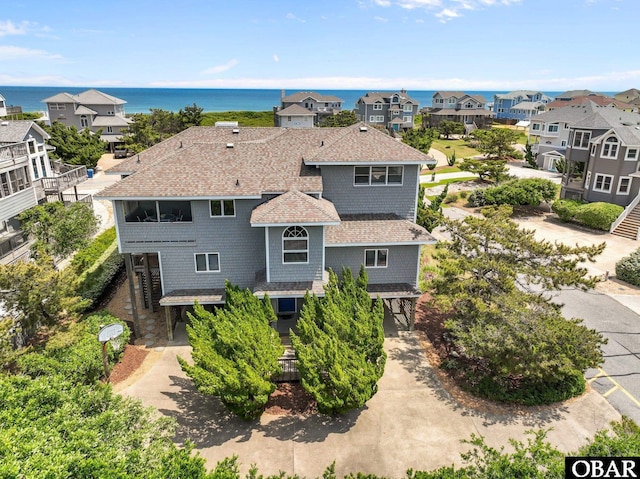 bird's eye view with a water view and a residential view