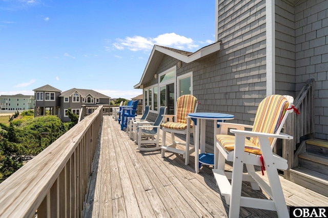 wooden deck featuring a residential view