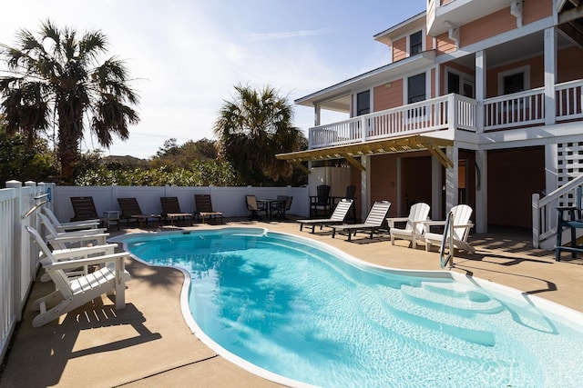 view of swimming pool with a fenced in pool, fence, and a patio