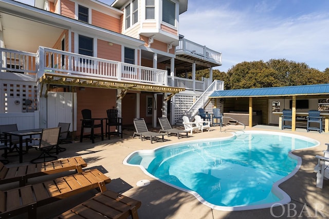 community pool featuring a patio area