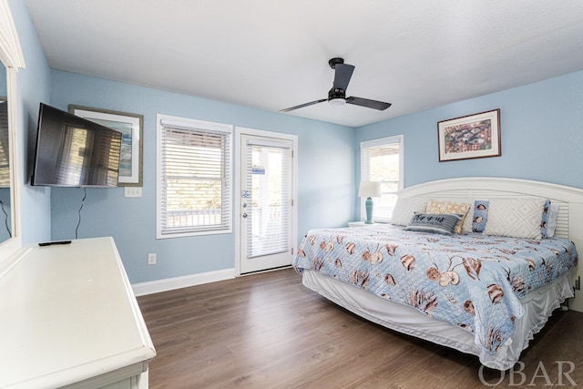 bedroom featuring dark wood-style floors, access to outside, ceiling fan, and baseboards