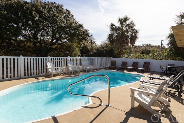 view of pool featuring a fenced in pool, fence, and a patio