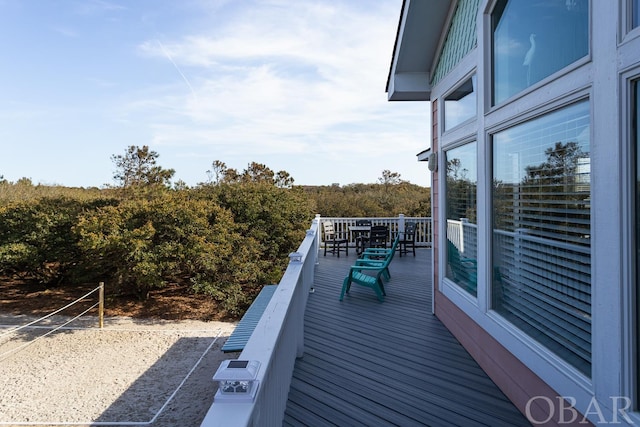 wooden deck with outdoor dining area