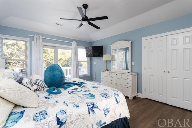 bedroom with dark wood finished floors, lofted ceiling, visible vents, a ceiling fan, and baseboards