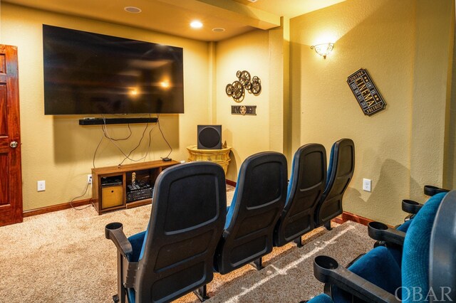 carpeted cinema with baseboards