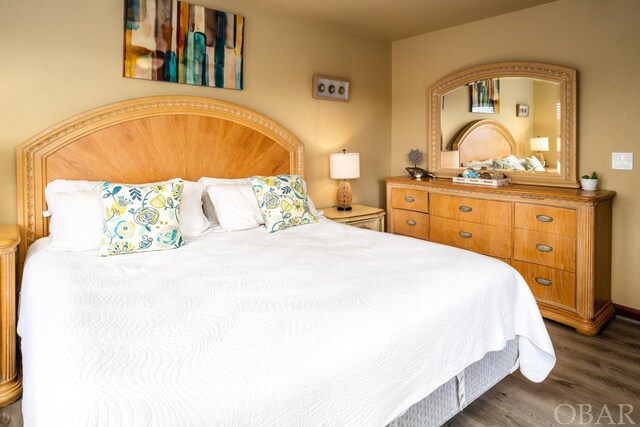 bedroom featuring dark wood finished floors