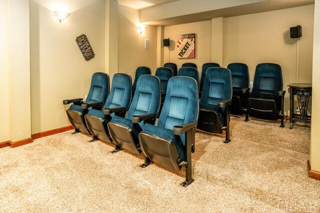 carpeted cinema with baseboards