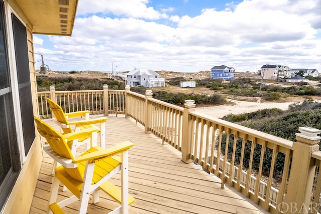 wooden terrace with a residential view