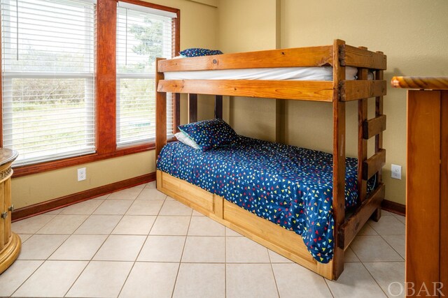 tiled bedroom with baseboards