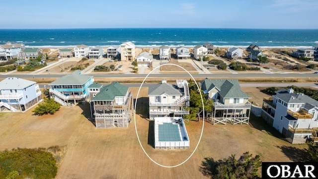 birds eye view of property featuring a residential view and a water view