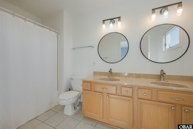 full bath featuring tile patterned flooring, a sink, toilet, and double vanity