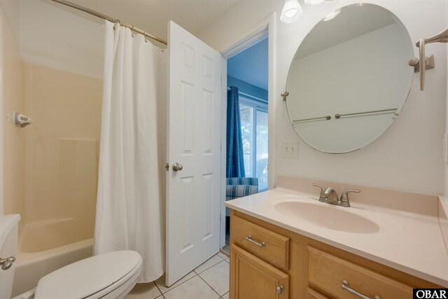 full bath featuring toilet, shower / tub combo, tile patterned flooring, and vanity