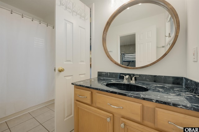 full bathroom with vanity and tile patterned floors