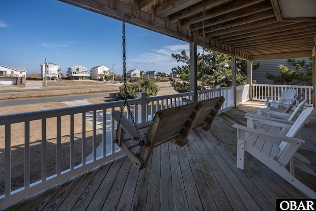 wooden deck with a residential view