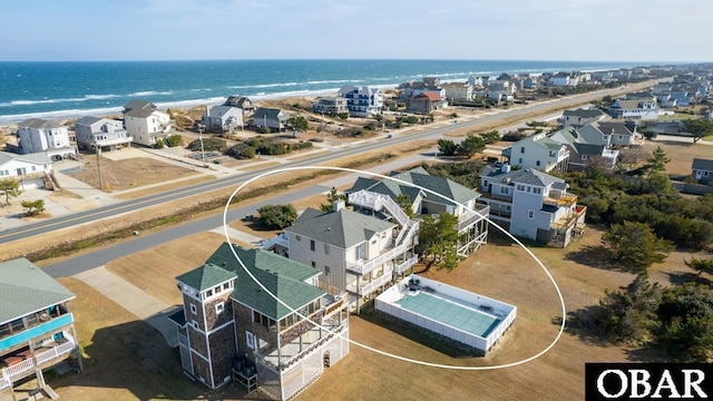 birds eye view of property with a water view and a residential view