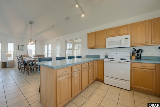 kitchen featuring light countertops, light tile patterned flooring, vaulted ceiling, white appliances, and a peninsula