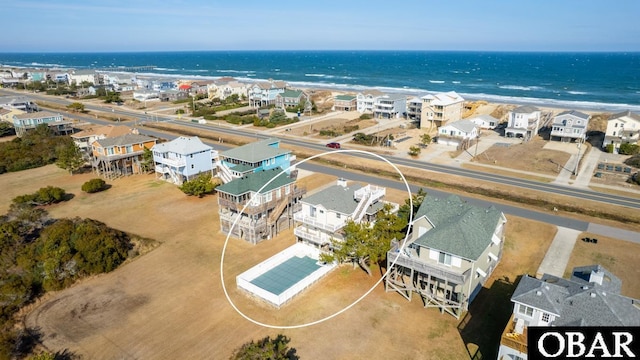 birds eye view of property with a residential view and a water view