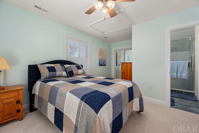 bedroom with light carpet, visible vents, baseboards, a closet, and attic access