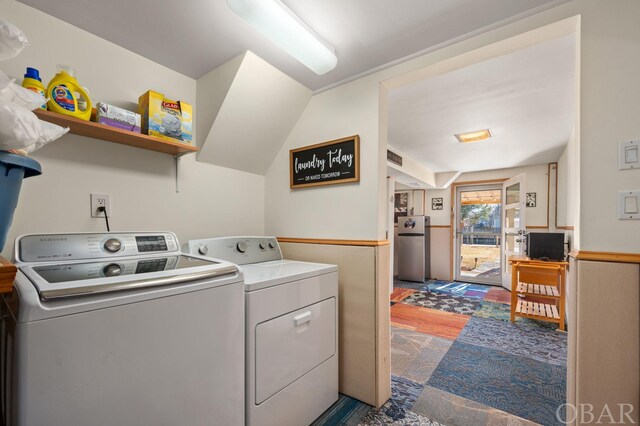 laundry room featuring laundry area and washing machine and clothes dryer