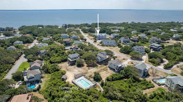 drone / aerial view featuring a water view and a residential view