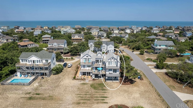 aerial view featuring a residential view and a water view