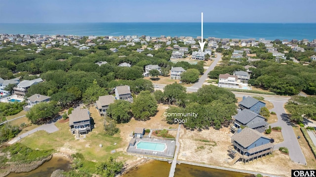 drone / aerial view featuring a residential view and a water view