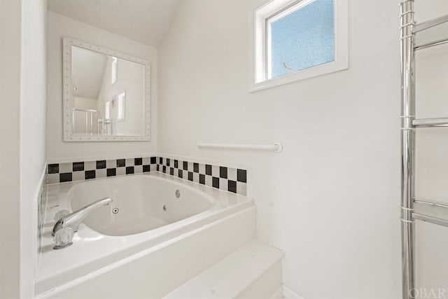 full bathroom featuring a jetted tub