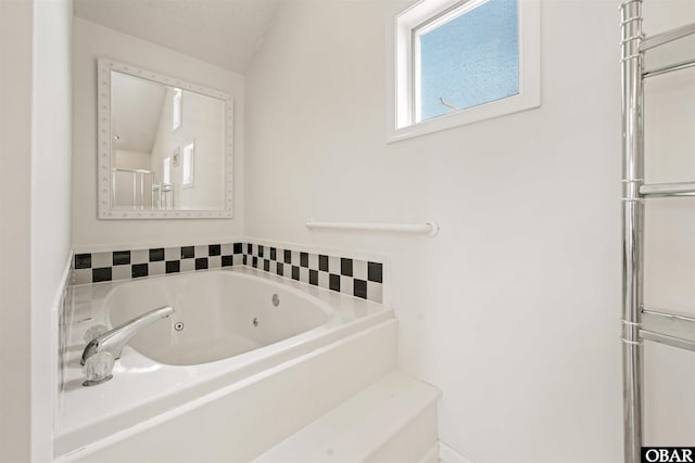 full bath with a tub with jets