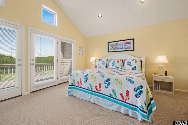 carpeted bedroom with access to outside, multiple windows, baseboards, and vaulted ceiling