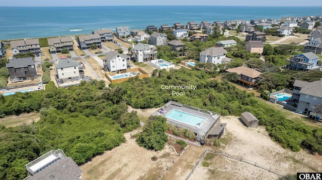aerial view featuring a water view and a residential view