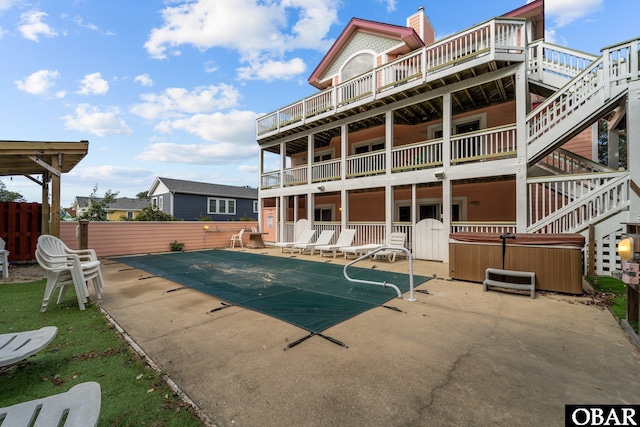 109 Duck Ridge Village Ct Lot 14, Duck, NC 27949 - rear view of property with a hot tub, a patio area, fence, stairs, and a wooden deck