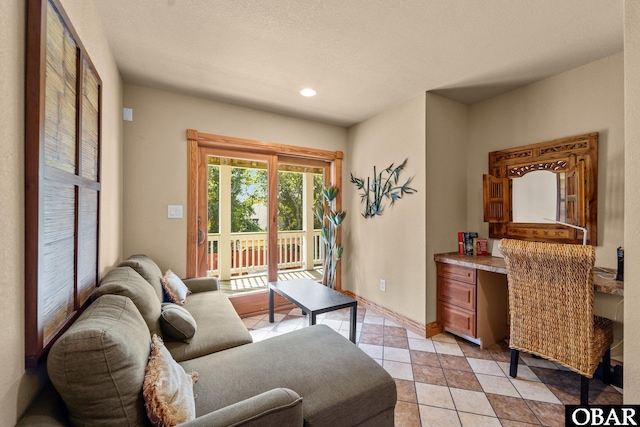 109 Duck Ridge Village Ct Lot 14, Duck, NC 27949 - living room with light tile patterned floors, recessed lighting, and a textured ceiling