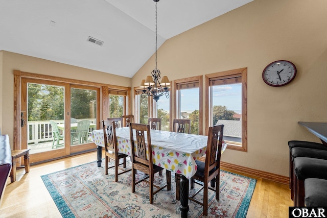 109 Duck Ridge Village Ct Lot 14, Duck, NC 27949 - dining room featuring lofted ceiling, a chandelier, light wood-style flooring, and baseboards