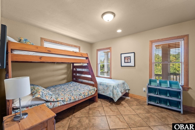 109 Duck Ridge Village Ct Lot 14, Duck, NC 27949 - tiled bedroom with baseboards and recessed lighting