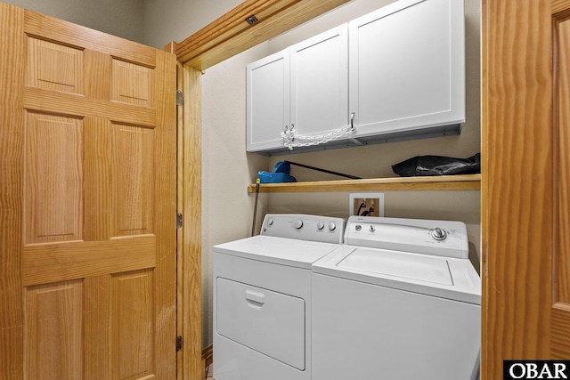 109 Duck Ridge Village Ct Lot 14, Duck, NC 27949 - laundry area with cabinet space and washing machine and dryer