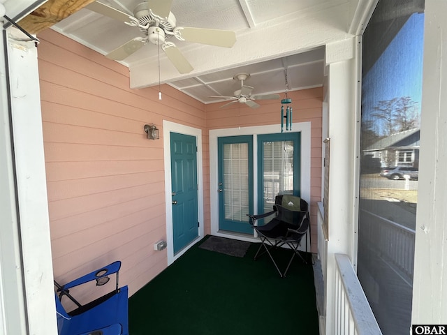 property entrance with a ceiling fan