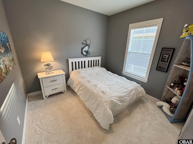 bedroom featuring light carpet