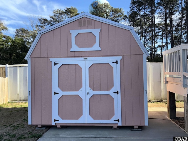 view of shed with fence